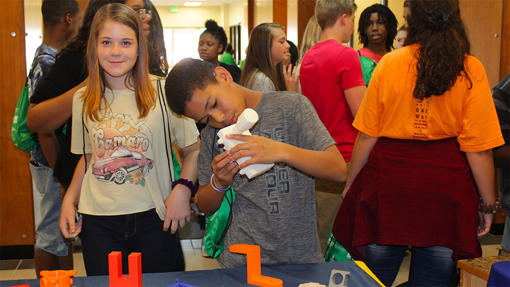 students doing experiment at career discovery event